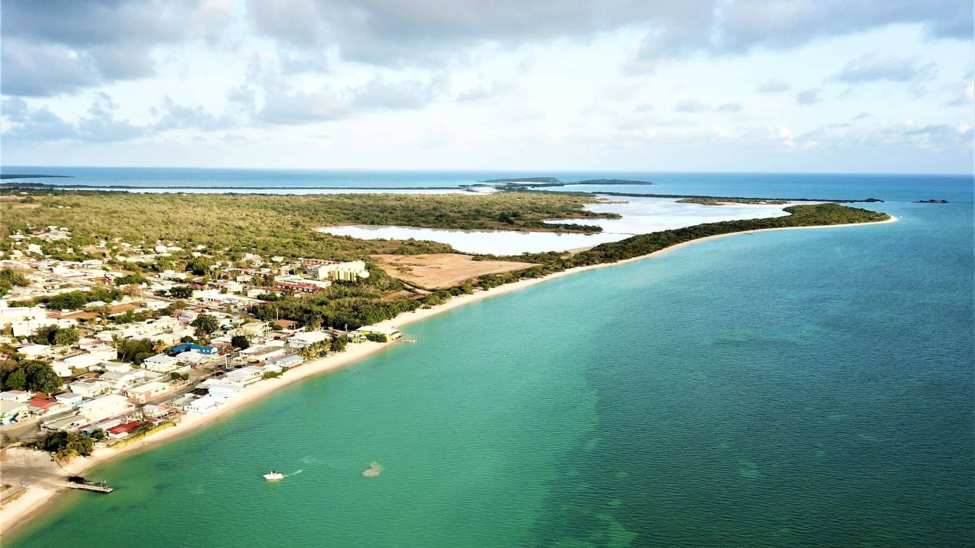 Aerial view of a town by lots of blue and blue green water